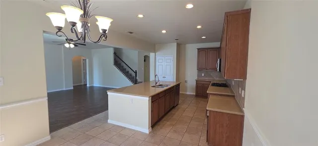 a view of a livingroom with furniture and staircase