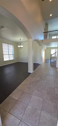 a view of a hallway with windows