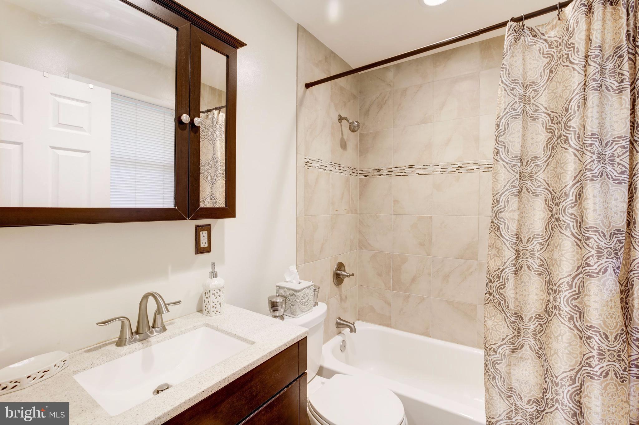 7909 Ellet Road Springfield, VA 22151 - Photo 17 of 30 a bathroom with a sink and a mirror