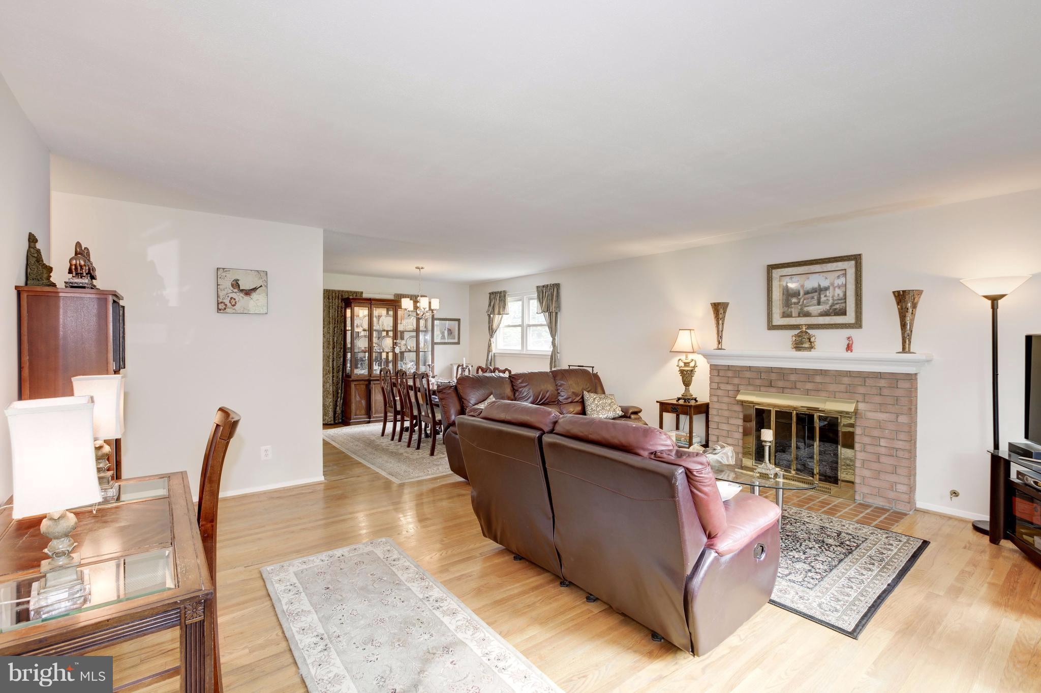 7909 Ellet Road Springfield, VA 22151 - Photo 3 of 30 a living room with furniture and a fireplace