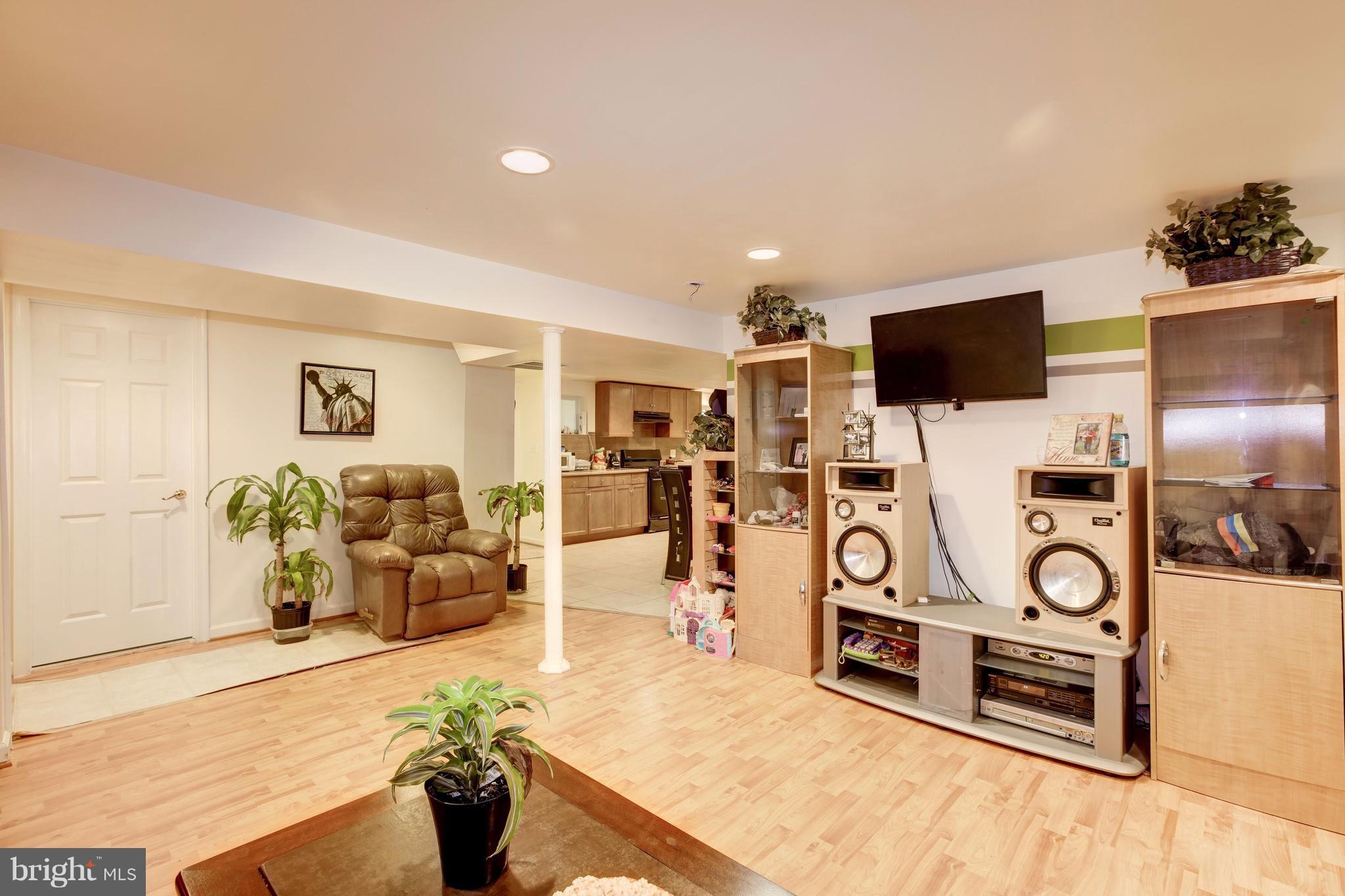 7909 Ellet Road Springfield, VA 22151 - Photo 22 of 30 a living room with furniture and a flat screen tv