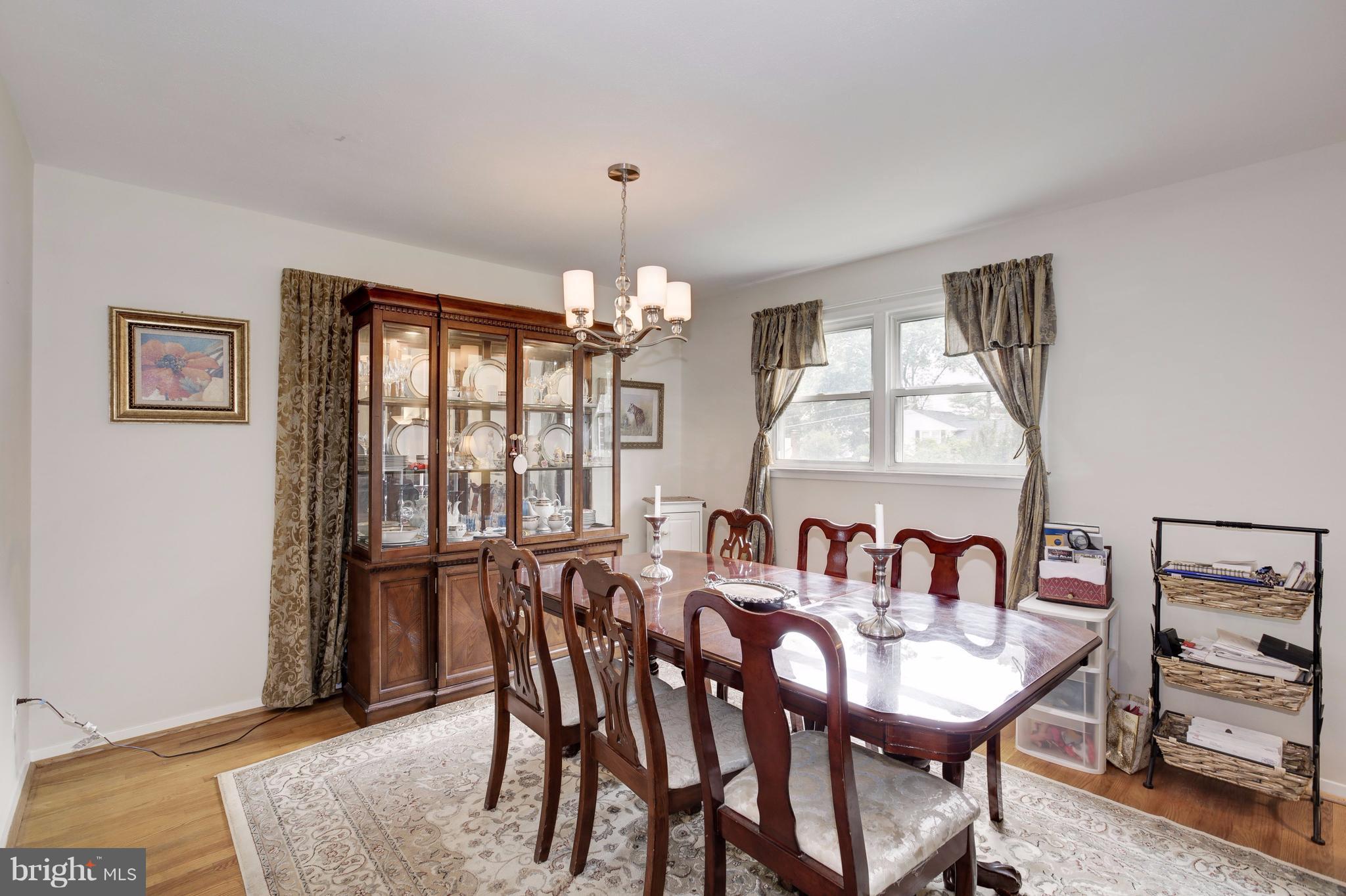7909 Ellet Road Springfield, VA 22151 - Photo 5 of 30 a view of a dining room with furniture and chandelier