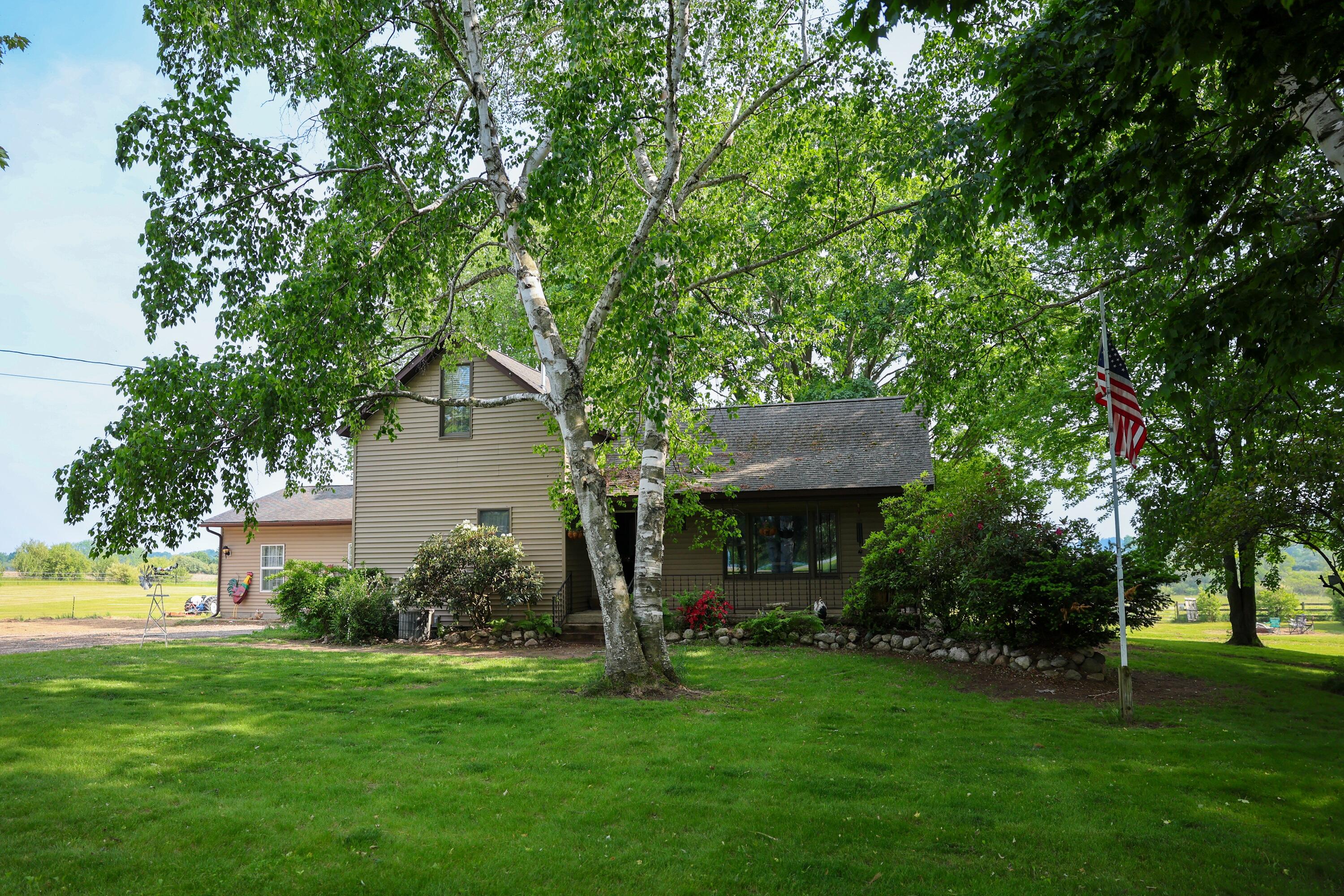1041 West Arthur Road Rothbury, MI 49452 - Photo 2 of 56 House Front 3 (2)