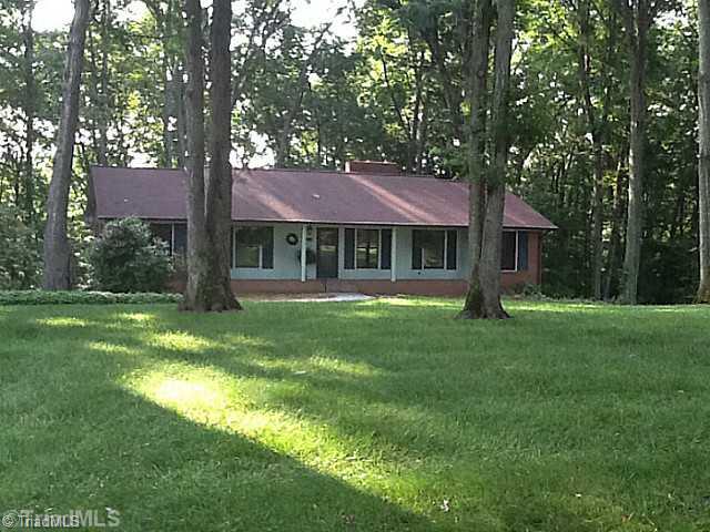 465 Doub Road Lewisville, NC 27023 - Photo 1 of 16 Exterior Front. beautifully wooded lot