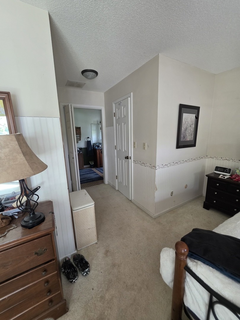 107 Comanche Trail Loda, IL 60948 - Photo 12 of 37 a bedroom with furniture and a rug
