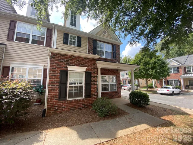 a view of a car park in front of a building