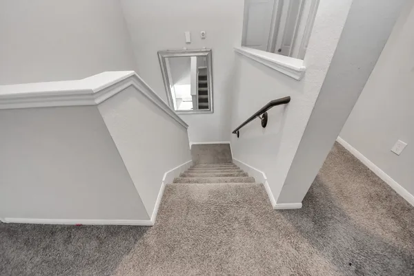 a bedroom with bed and window