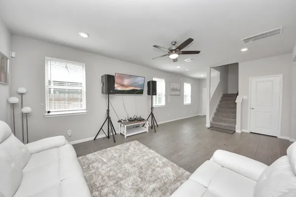 a living room with furniture and a large window