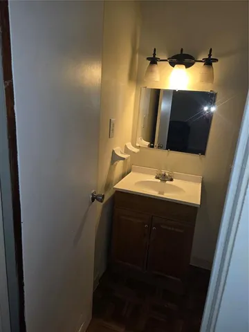 a bathroom with a sink and mirror