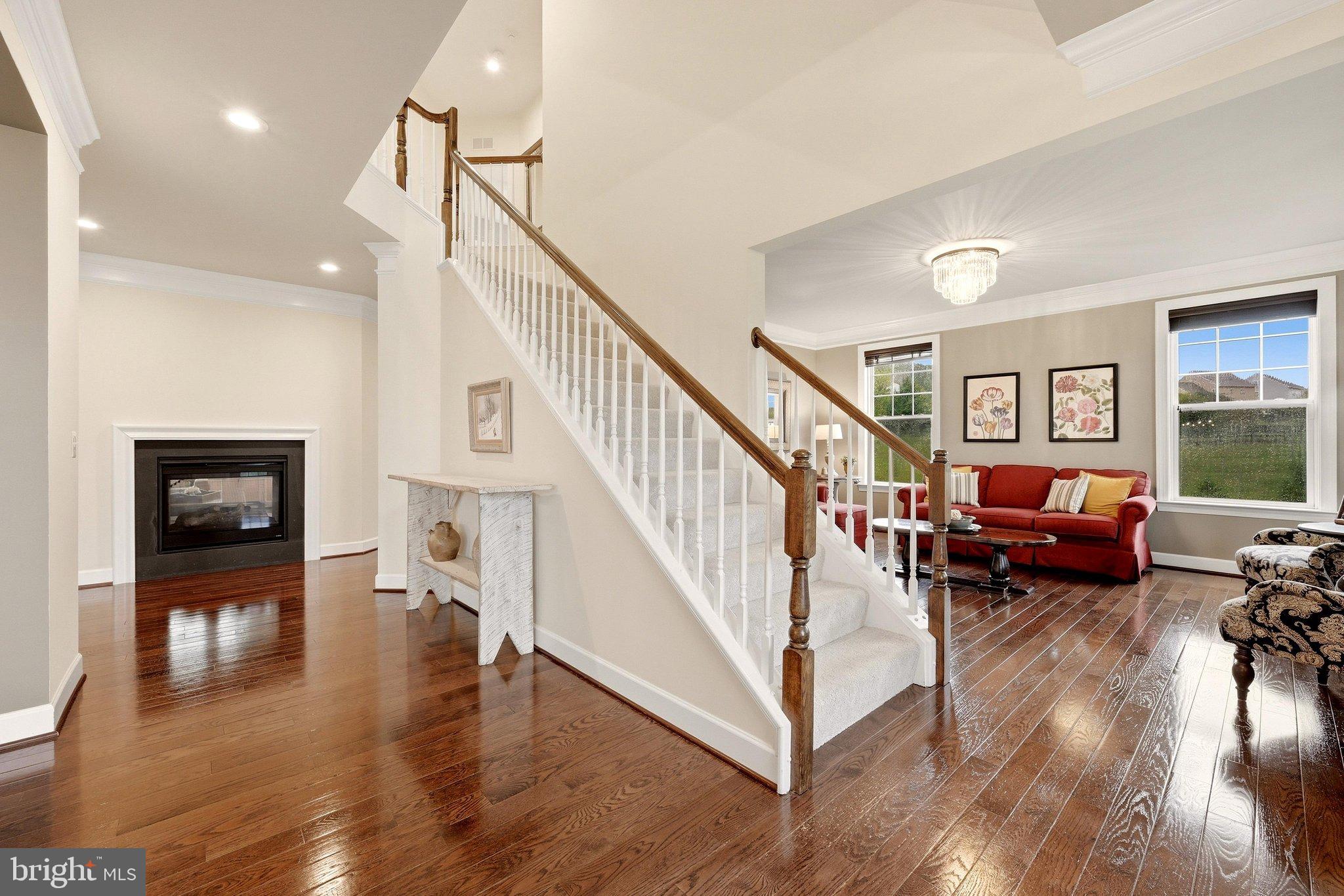 15547 Montresor Road Leesburg, VA 20176 - Photo 24 of 92 Open staircase & lit fireplace
