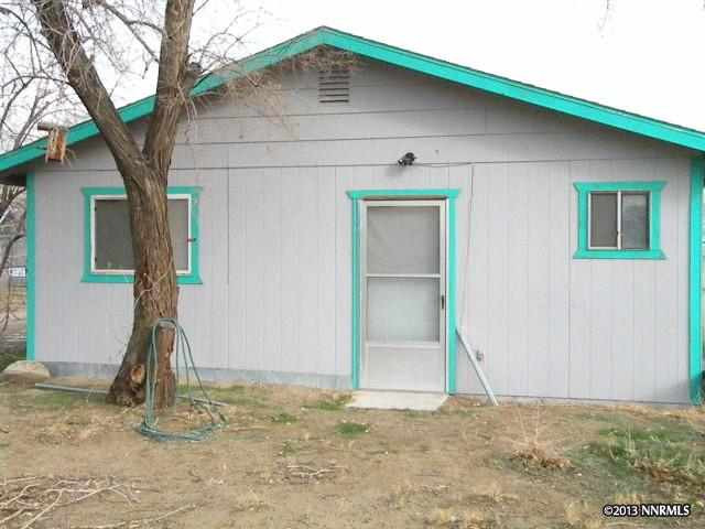 795 Wade Lane Fallon, NV 89406 - Photo 1 of 1 a house with trees in the background