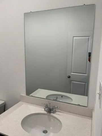 a bathroom with a sink and vanity