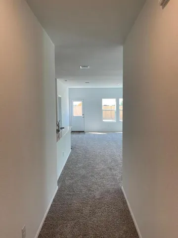 a view of hallway with windows