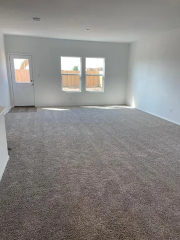 an empty room that has a window