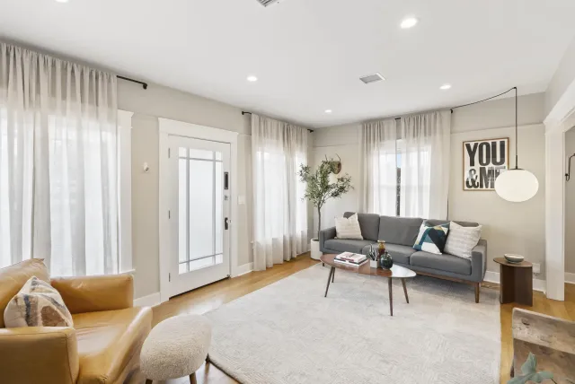 a living room with furniture and a window