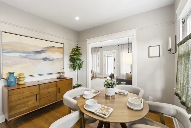 a view of a dining room with furniture window and wooden floor