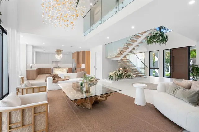 a dining room with furniture a chandelier and window