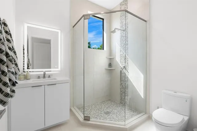 a view of a house with swimming pool and sitting area