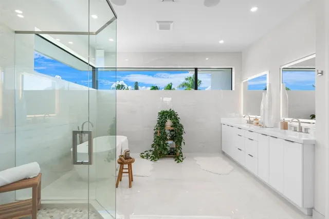 an aerial view of residential houses with city view