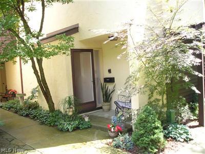 Welcome to 1064 Hampton Ridge...a well maintained carriage house condo in a private location overlooking woods.