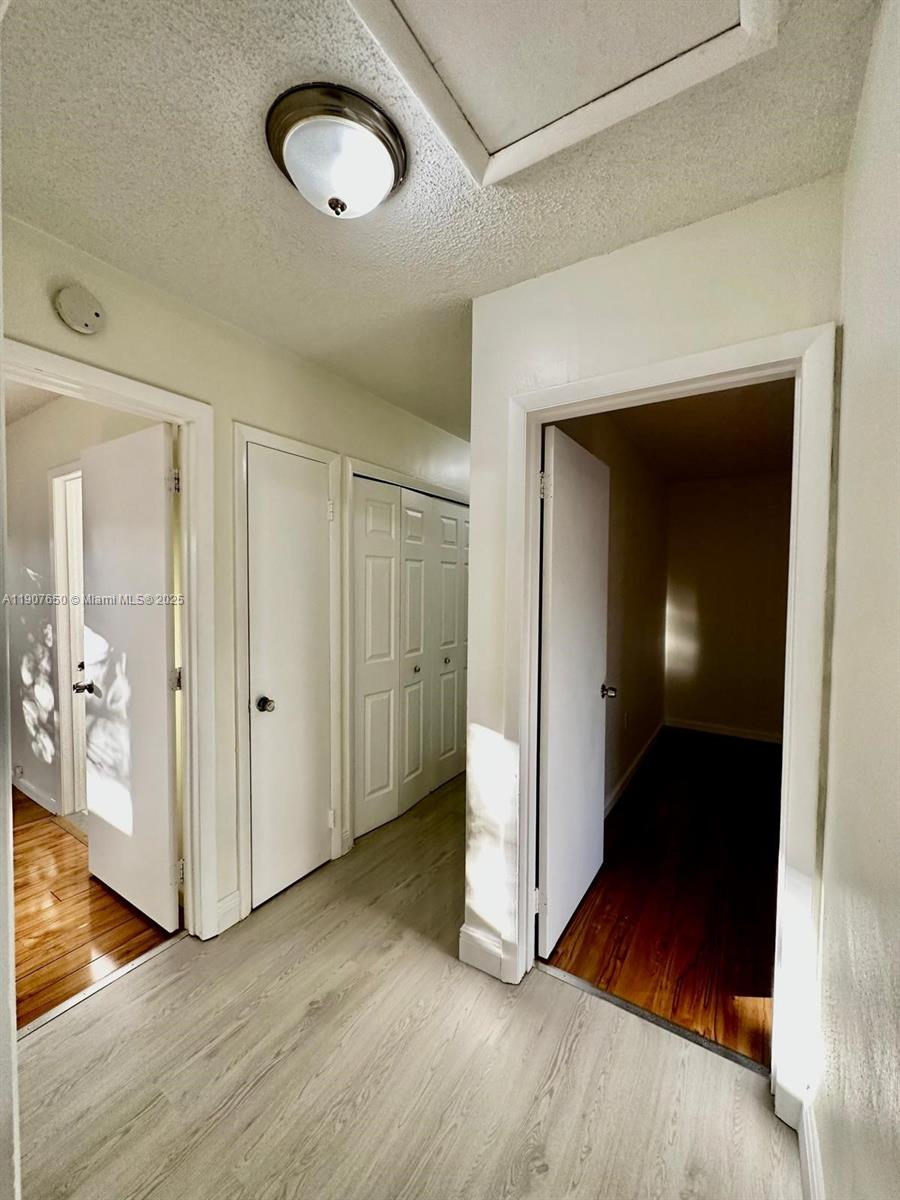 8420 Southwest 102nd Avenue, Unit 8420 Miami, FL 33173 - Photo 6 of 12 a view of a hallway with wooden floor