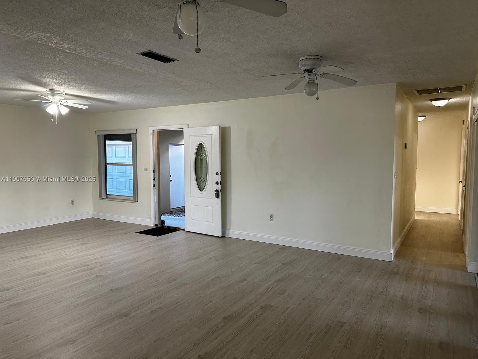 8420 Southwest 102nd Avenue, Unit 8420 Miami, FL 33173 - Photo 10 of 12 an empty room with windows and closet