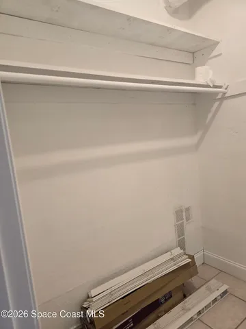 a bathroom with a sink vanity and mirror