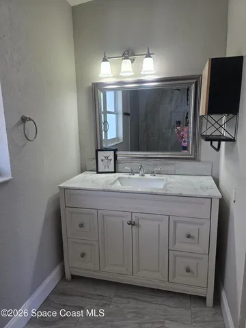 a bathroom with a toilet and shower