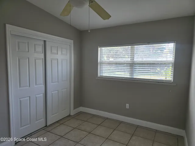 a view of an empty room and utility room