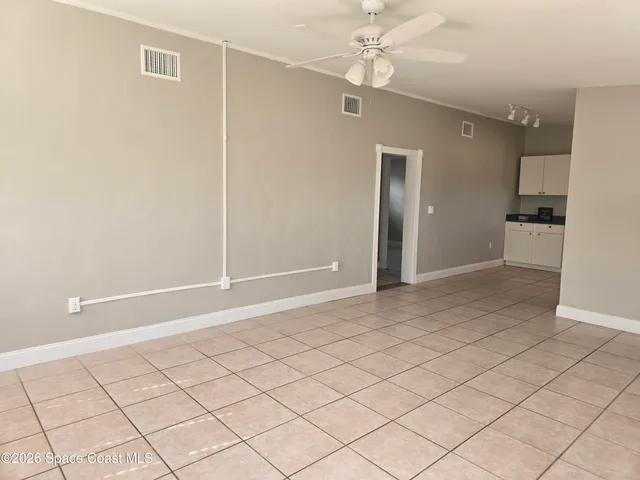 a view of an empty room and window