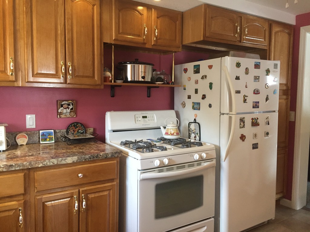 226 Winton Street Springfield, MA 01118 - Photo 7 of 27 a kitchen with granite countertop a stove and a sink