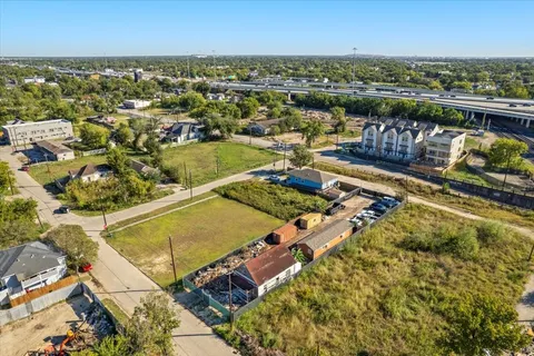 an aerial view of a residential building with outdoor space