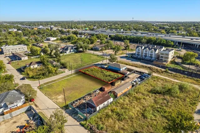 an aerial view of a residential building with outdoor space
