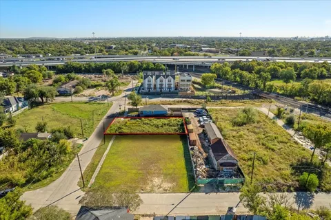 an aerial view of a house with a lake view