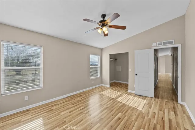 a spacious bathroom with a tub a double vanity sink and mirror