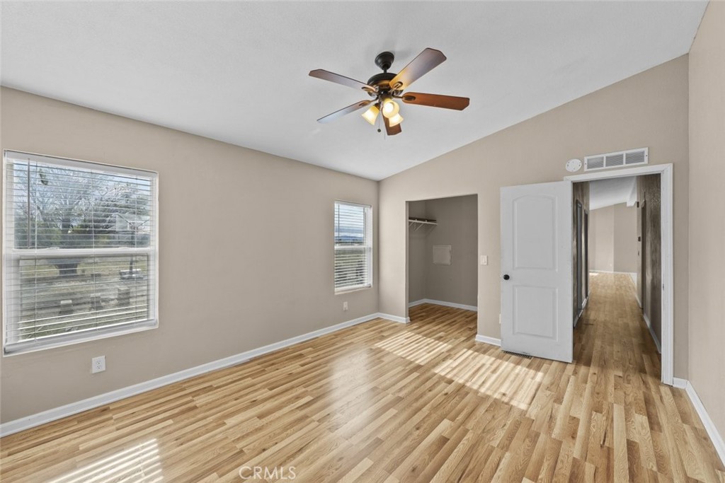 6142 Rare Rabbit Avenue Mojave, CA 93501 - Photo 36 of 50 a view of empty room with wooden floor and fan