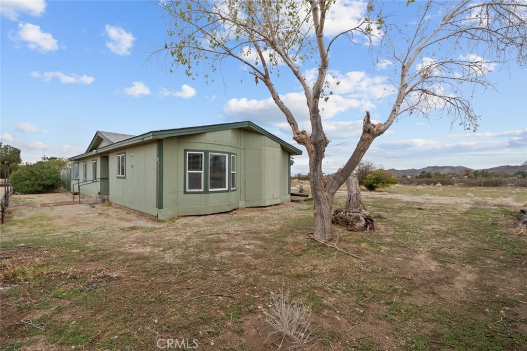 6142 Rare Rabbit Avenue Mojave, CA 93501 - Photo 40 of 50 a view of a house with a yard
