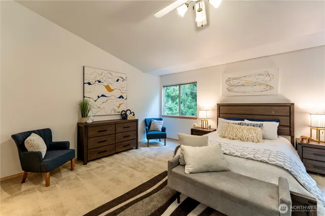 a bedroom with furniture and a window