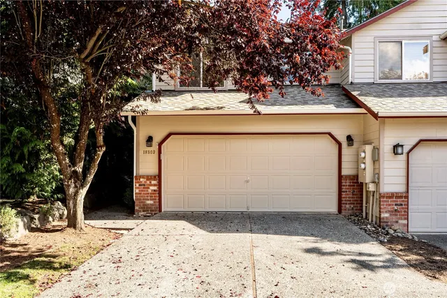 a view of a house with a snow in the background