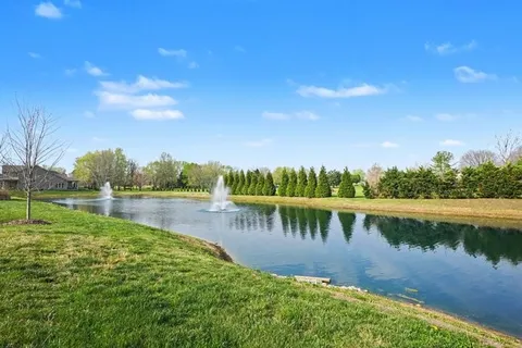 a view of a lake with a yard