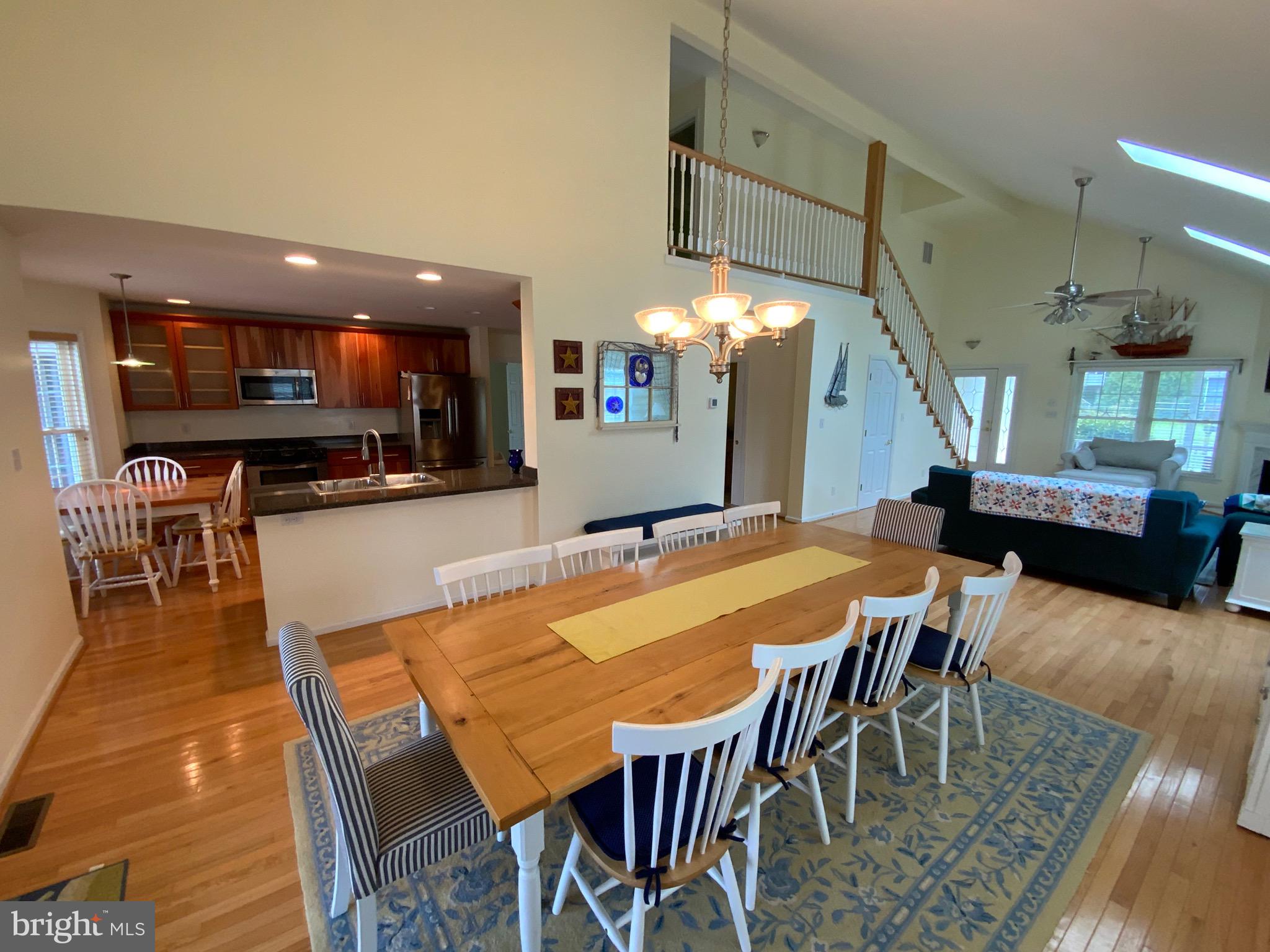 38211 Marlington Road Ocean View, DE 19970 - Photo 11 of 56 a dining hall with stainless steel appliances a dining table and chairs