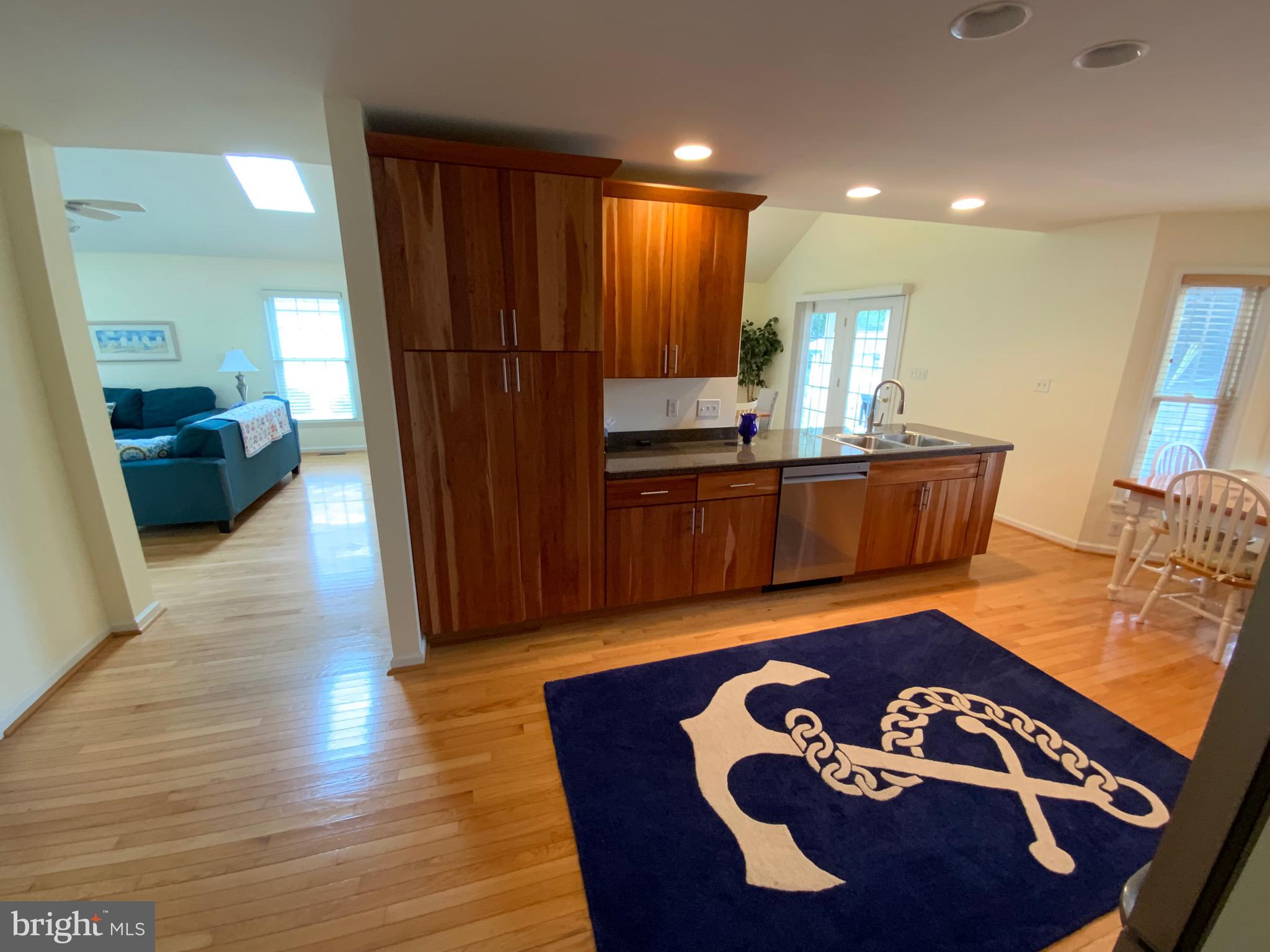 38211 Marlington Road Ocean View, DE 19970 - Photo 15 of 56 a living room with furniture and wooden floor