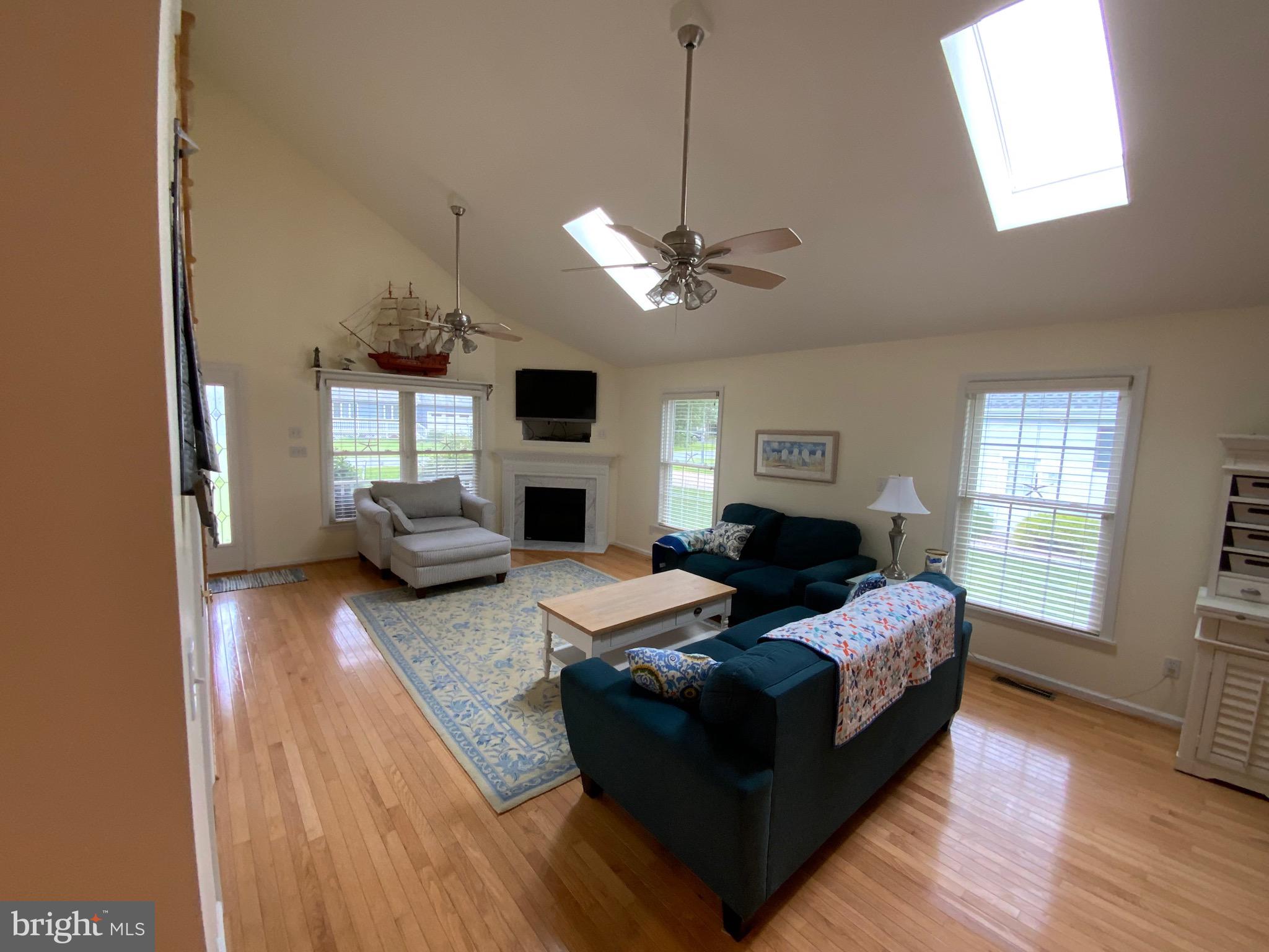 38211 Marlington Road Ocean View, DE 19970 - Photo 16 of 56 a living room with furniture ceiling fan and a window