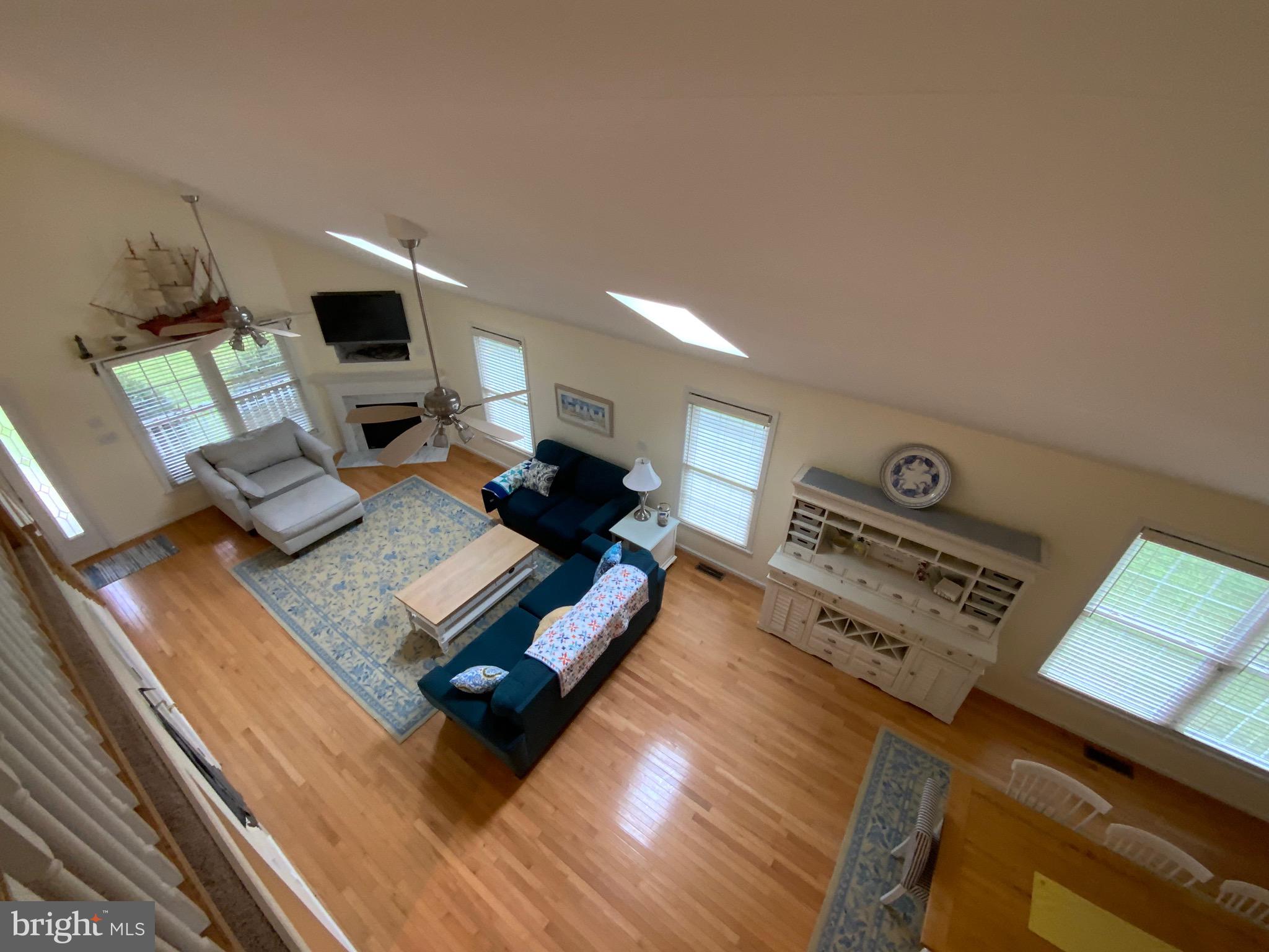 38211 Marlington Road Ocean View, DE 19970 - Photo 19 of 56 a living room with furniture and a flat screen tv