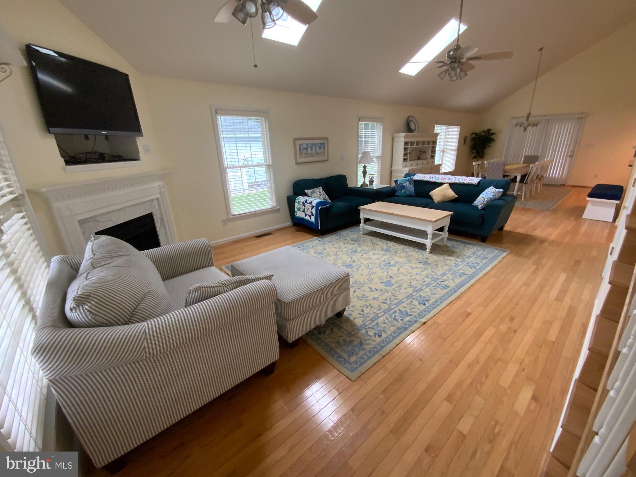 38211 Marlington Road Ocean View, DE 19970 - Photo 20 of 56 a living room with furniture and a flat screen tv
