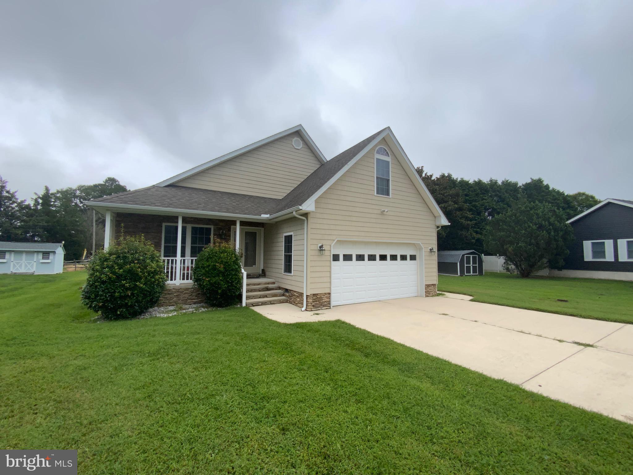 38211 Marlington Road Ocean View, DE 19970 - Photo 2 of 56 a view of a house with a yard and sitting area