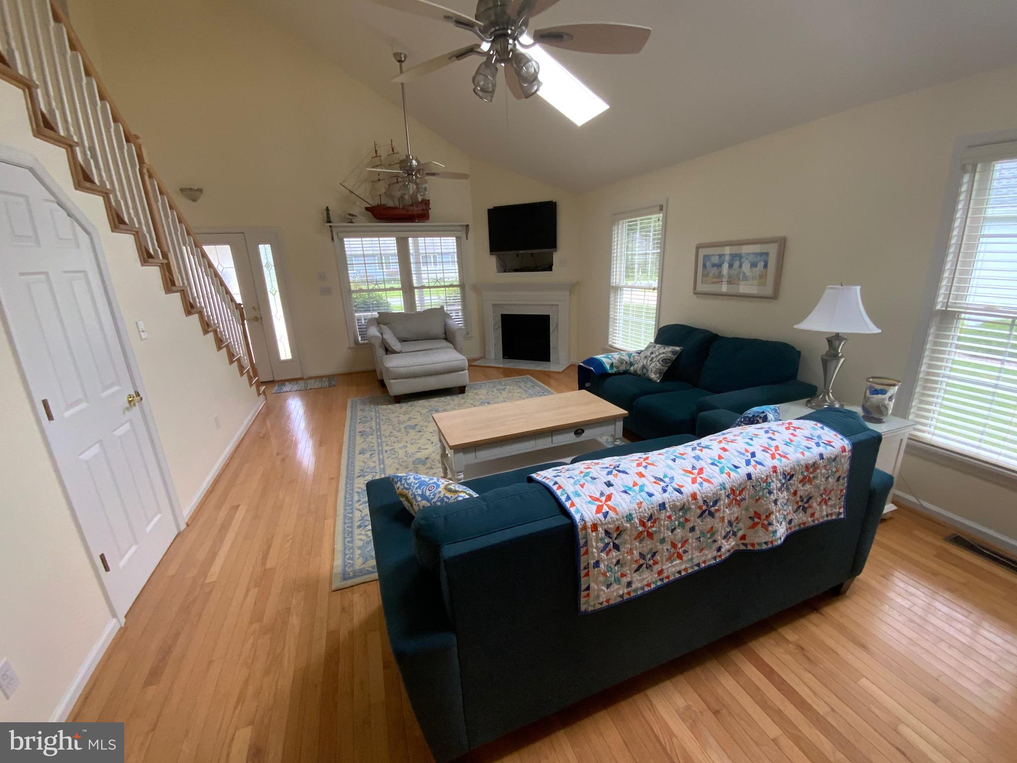 38211 Marlington Road Ocean View, DE 19970 - Photo 21 of 56 a living room with furniture fireplace and flat screen tv