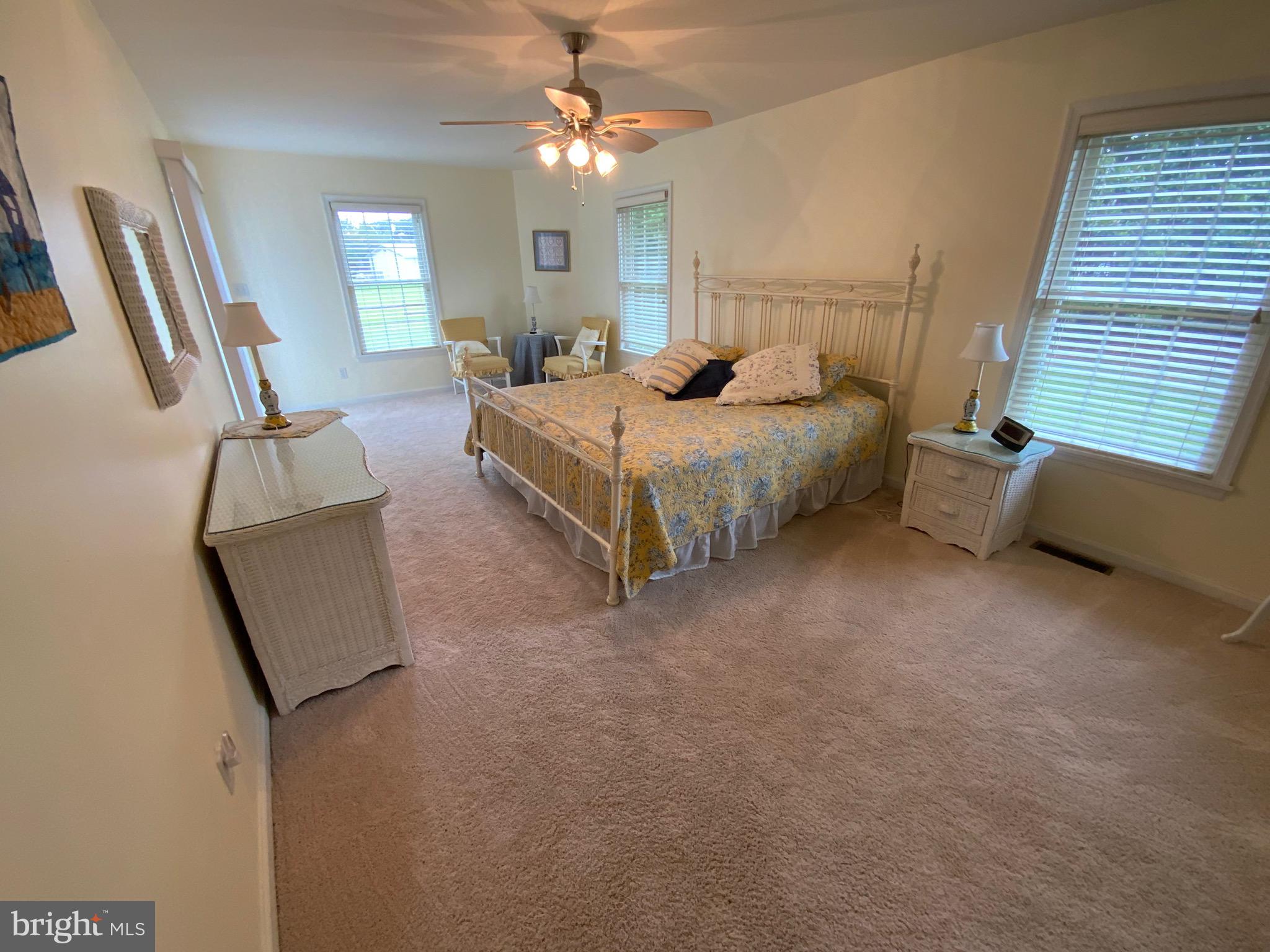 38211 Marlington Road Ocean View, DE 19970 - Photo 23 of 56 a bedroom with a bed couch and window