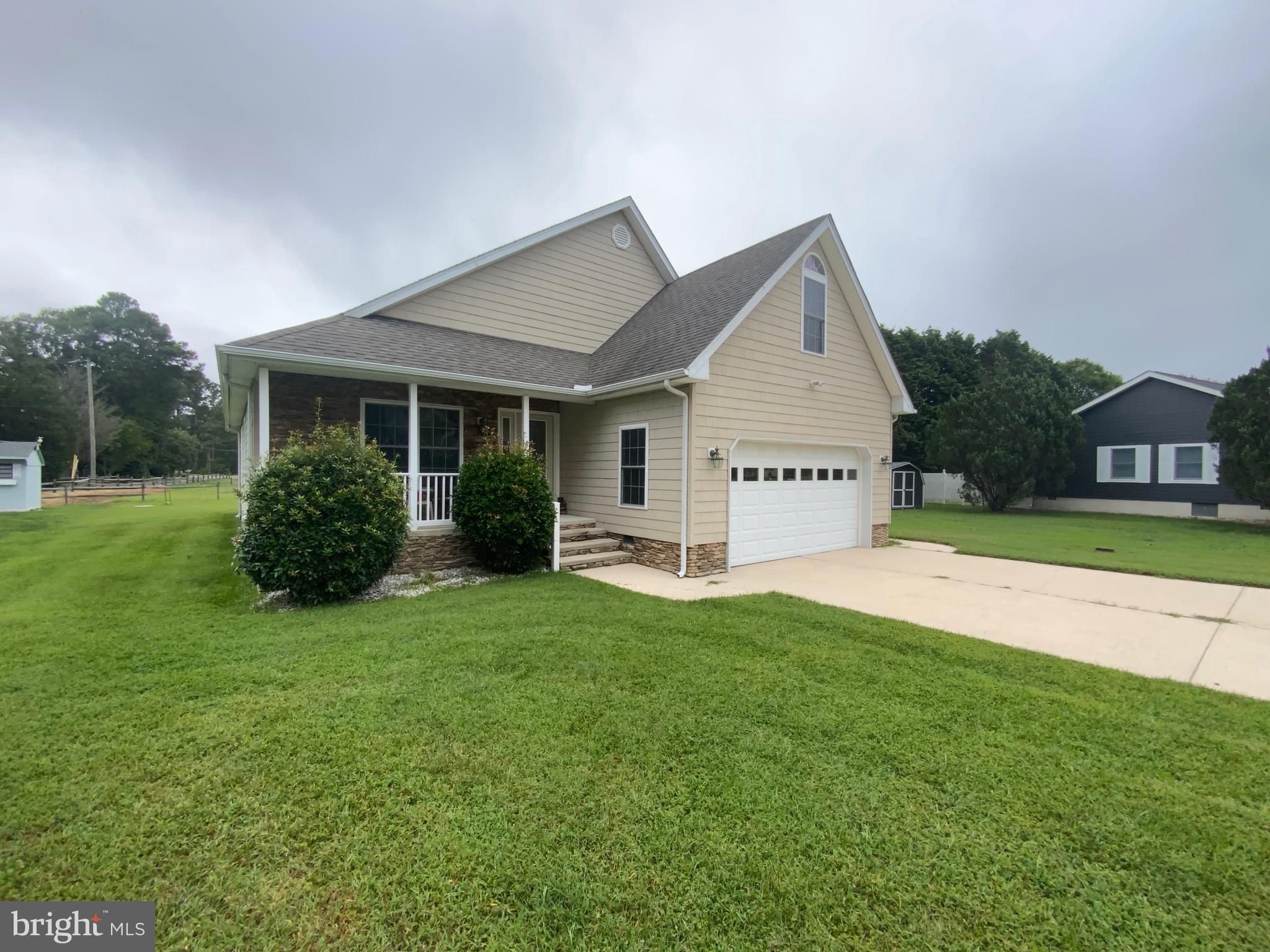 38211 Marlington Road Ocean View, DE 19970 - Photo 3 of 56 a view of a house with a yard and a garden