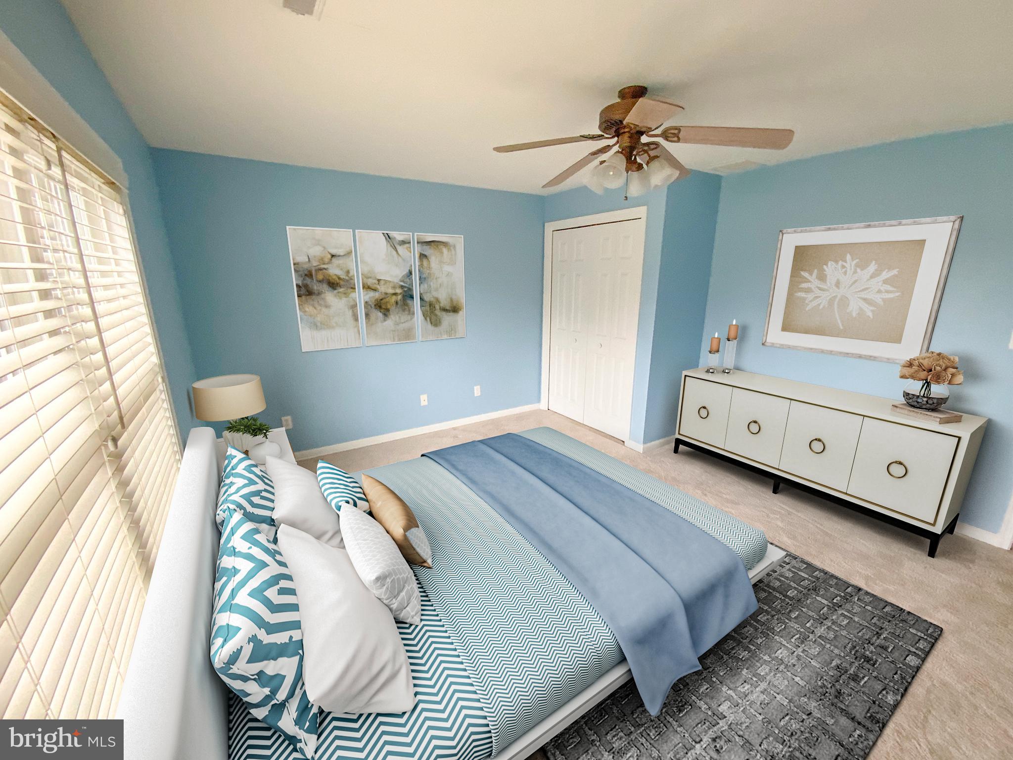 38211 Marlington Road Ocean View, DE 19970 - Photo 31 of 56 a bedroom with a bed and a chandelier